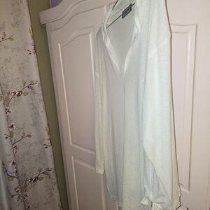 Sheer white beach shirt with hood and tie on side. Fits up to 2X